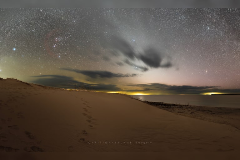 A sunset over Sleeping Bear Point quickly turns into an evening filled with stars such as the Orion constellation, zodiacal light from the sun's rays refle...