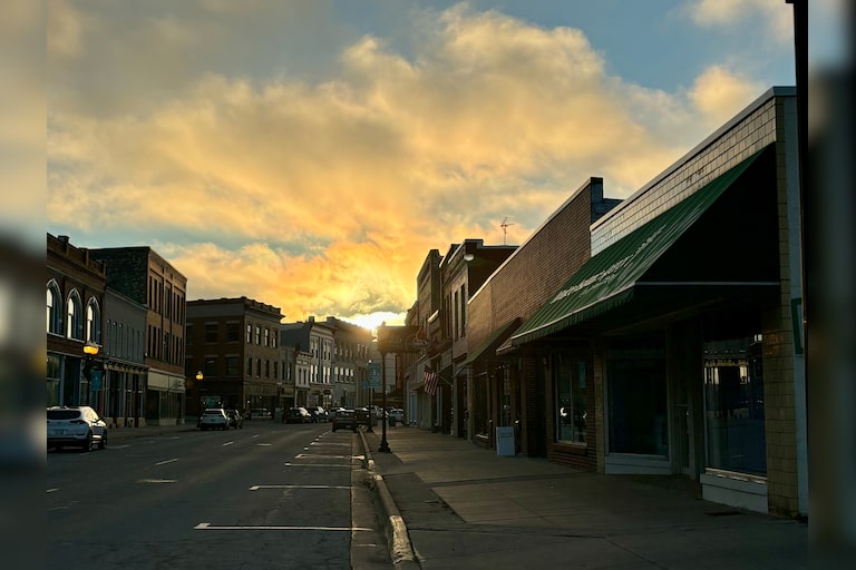 Sunset glowing from River Street in Manistee