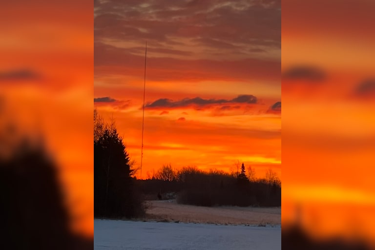 Sunrise with a sun dog 9/10 tower in Goetzville, Mi. At side of photo
